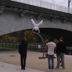 Center right: A kid practicing acrobatic moves along a street in Orleans