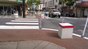 Curb extension at Nuuanu/Pauahi. Not only do they cut down the crossing distance, but they provide room for bike parking as well.